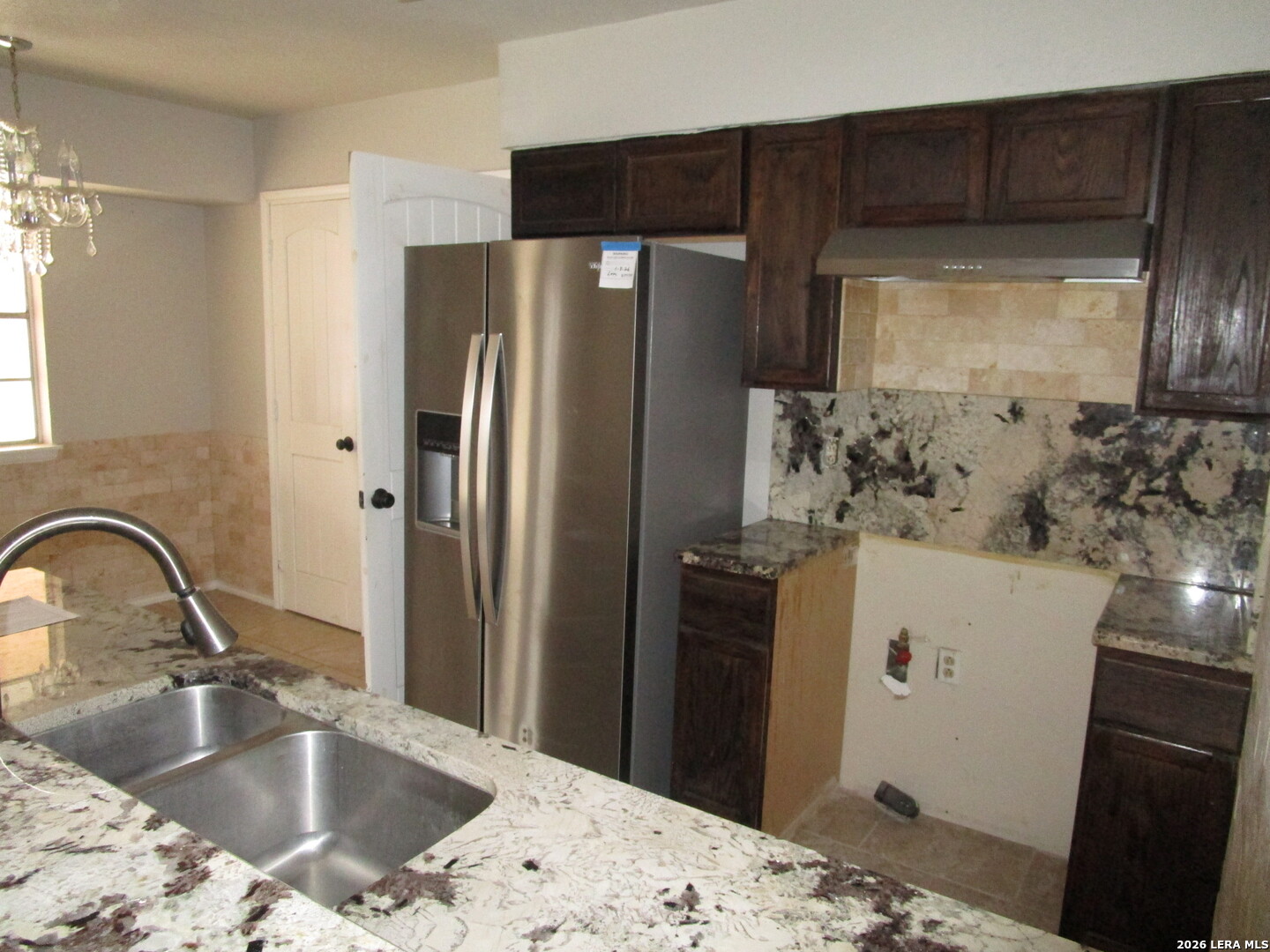 7106 Timber Ridge Drive San Antonio, TX 78227 - Photo 9 of 13 a bathroom with a sink and a mirror