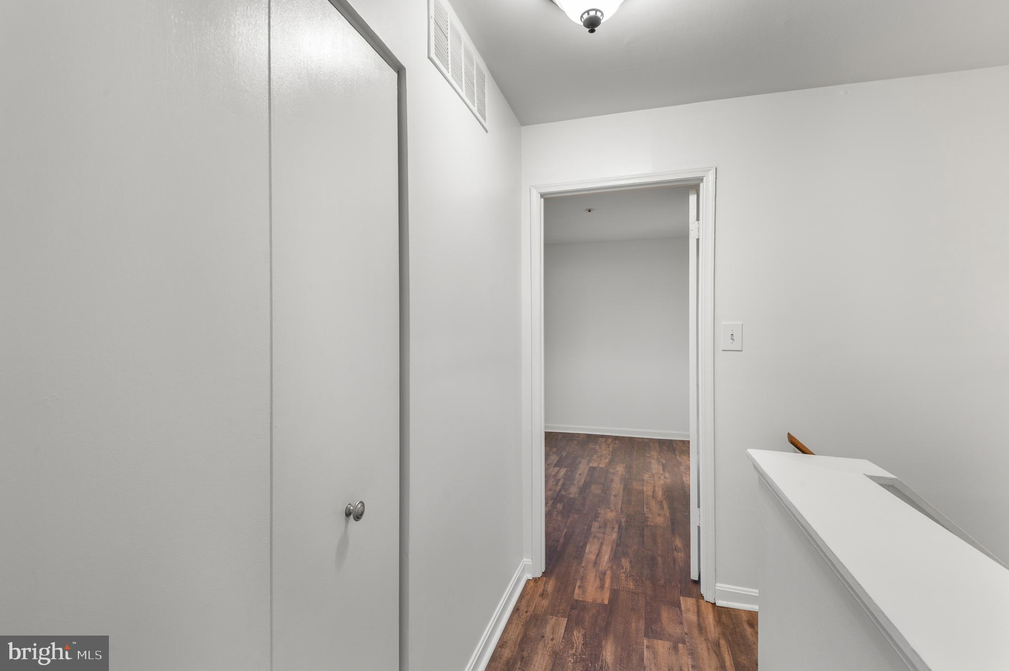 4942 Columbia Road, Unit 5 37 Columbia, MD 21044 - Photo 15 of 36 a view of a hallway with wooden floor