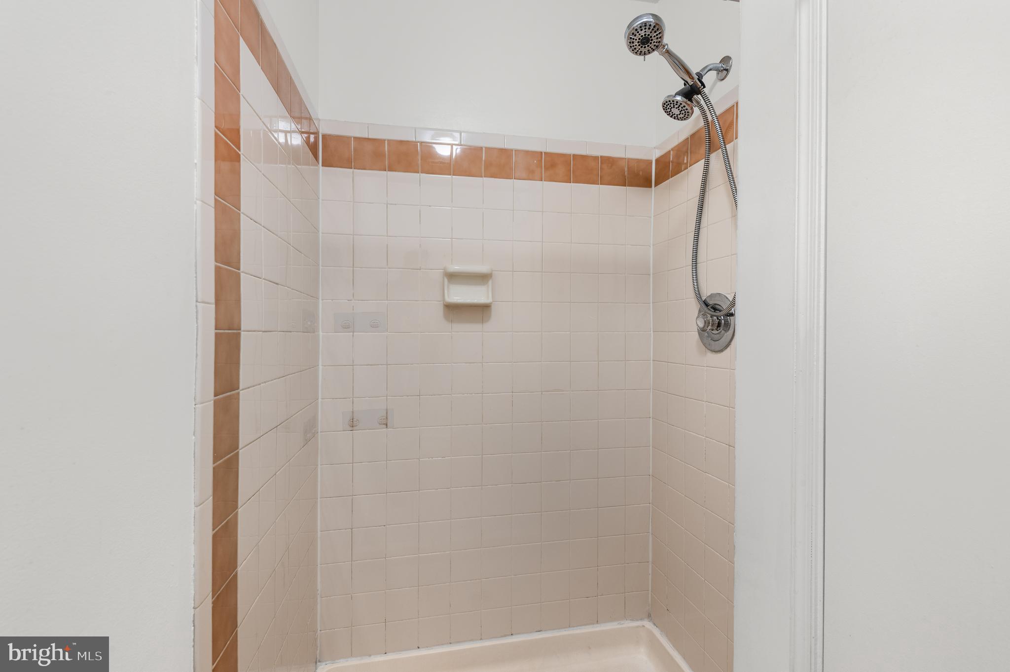 4942 Columbia Road, Unit 5 37 Columbia, MD 21044 - Photo 19 of 36 a bathroom with a shower