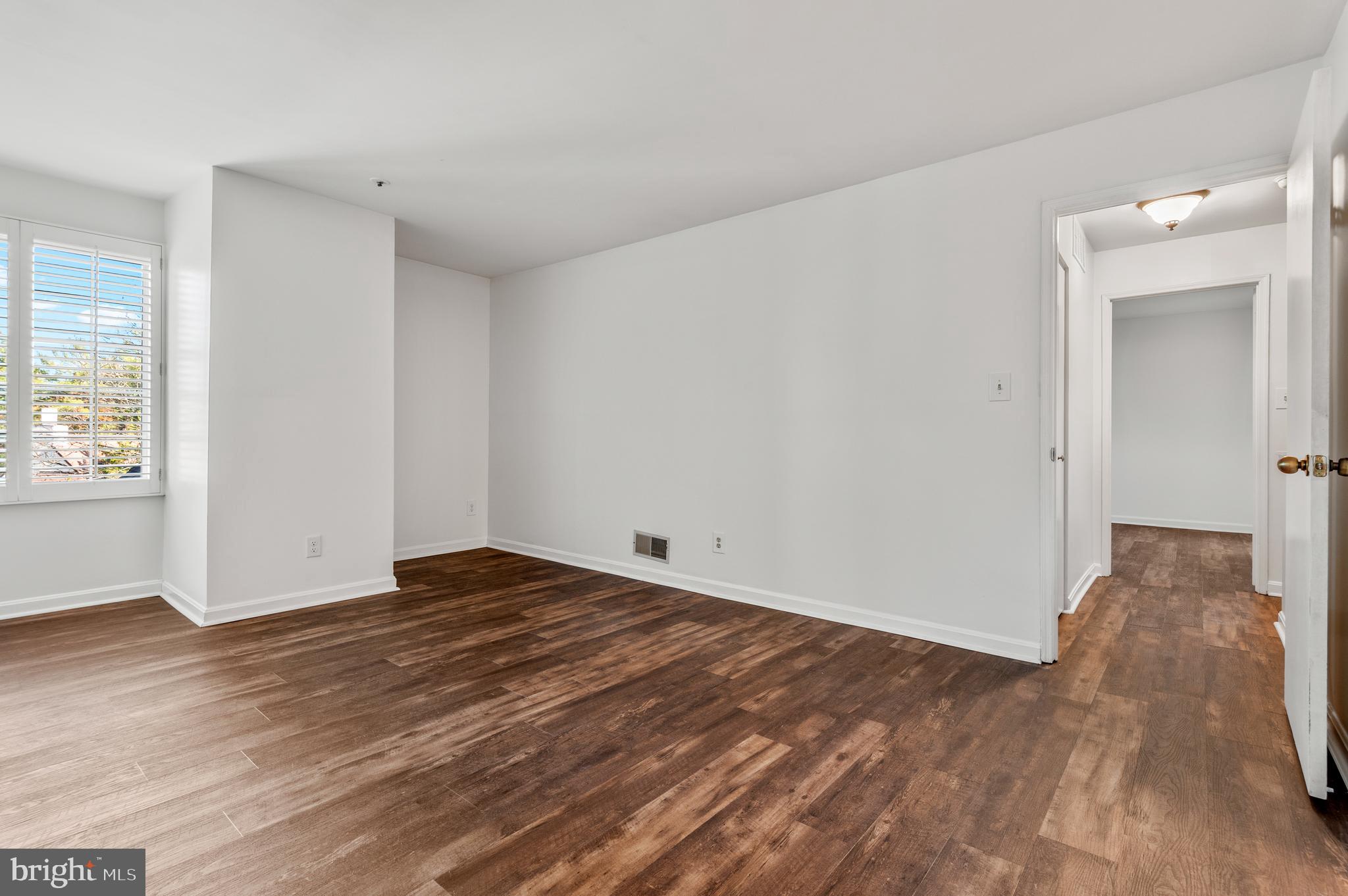 4942 Columbia Road, Unit 5 37 Columbia, MD 21044 - Photo 21 of 36 a view of room with wooden floor and window