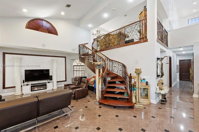 a living room with lots of furniture and a flat screen tv