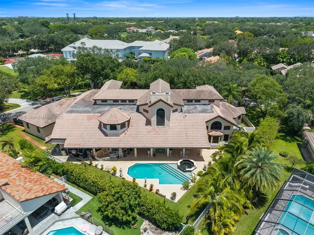 an aerial view of a house with a garden