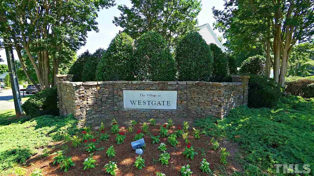 8900 Shallcross Way Raleigh, NC 27617 - Photo 1 of 22 a sign on the side of the road