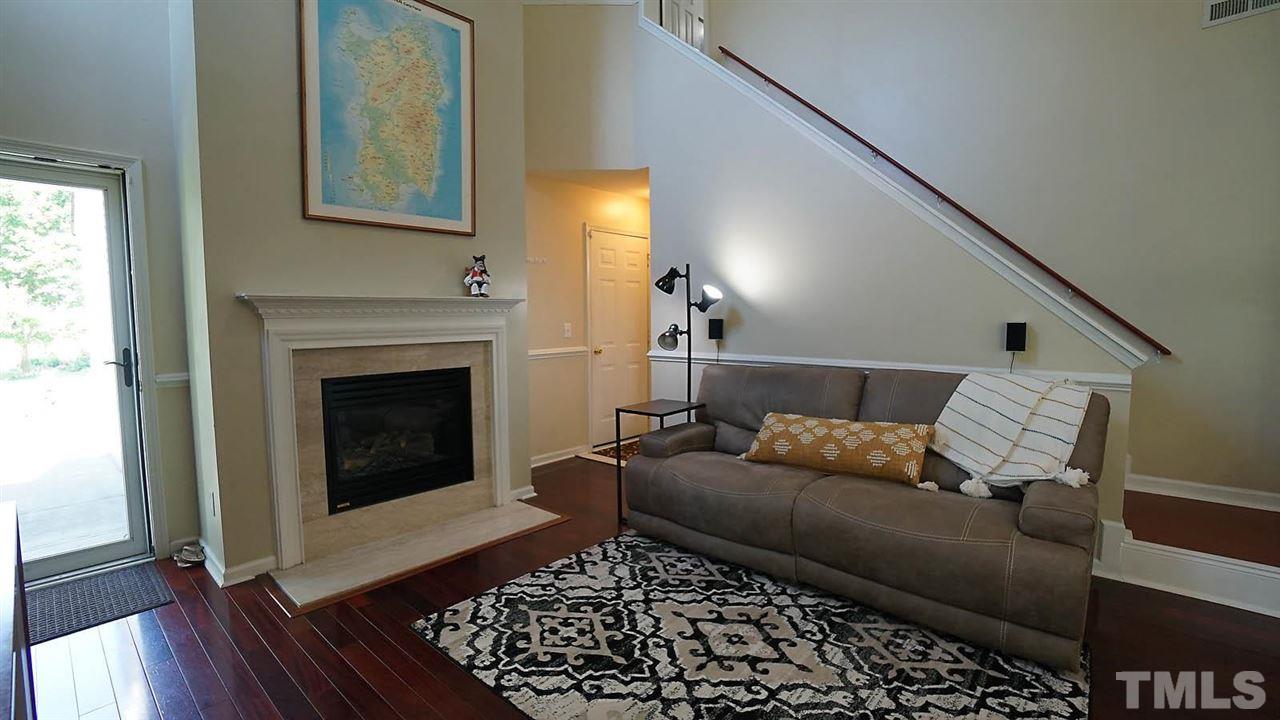 8900 Shallcross Way Raleigh, NC 27617 - Photo 3 of 22 a living room with furniture and a fireplace
