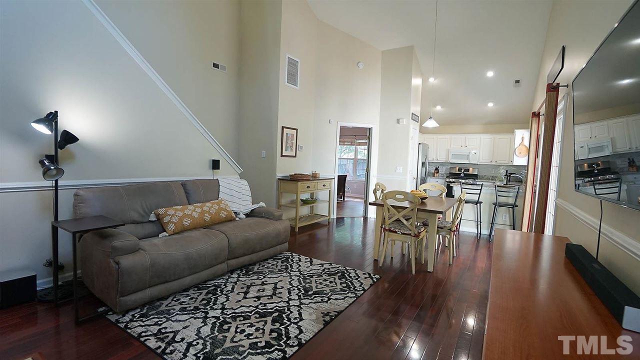 8900 Shallcross Way Raleigh, NC 27617 - Photo 4 of 22 a living room with furniture and a wooden floor