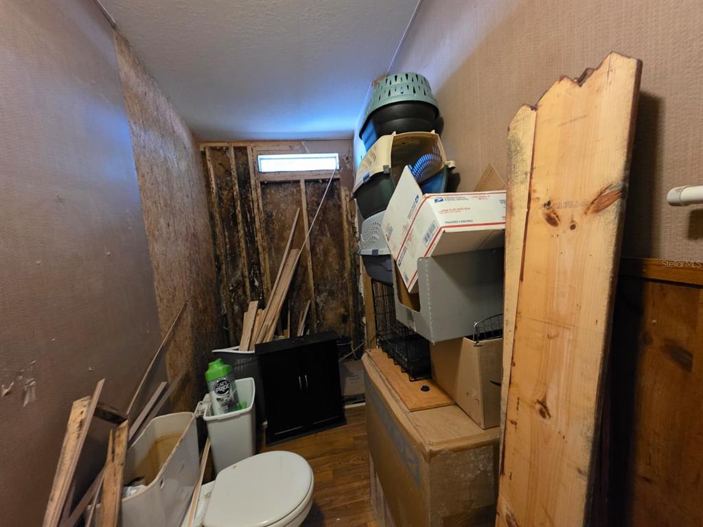 2000 Palm Street St. Cloud, FL 34769 - Photo 14 of 21 a bathroom with a toilet and a sink