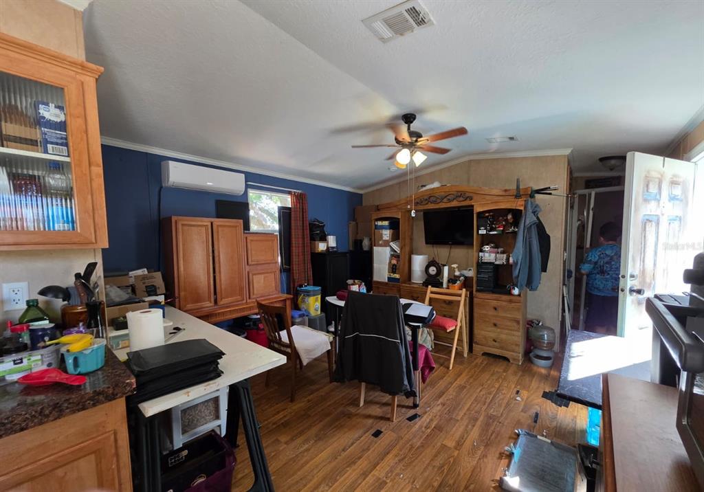 2000 Palm Street St. Cloud, FL 34769 - Photo 16 of 21 a view of a livingroom with furniture a ceiling fan and wooden floor