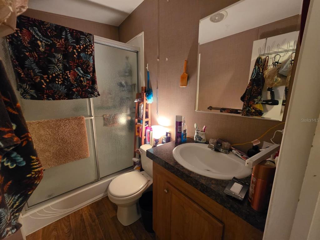 2000 Palm Street St. Cloud, FL 34769 - Photo 17 of 21 a bathroom with a sink toilet and shower