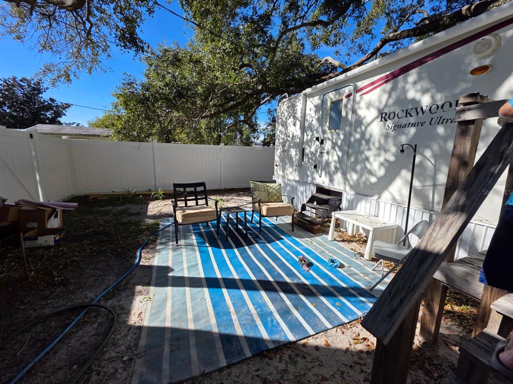 2000 Palm Street St. Cloud, FL 34769 - Photo 7 of 21 a view of balcony with wooden floor and outdoor seating