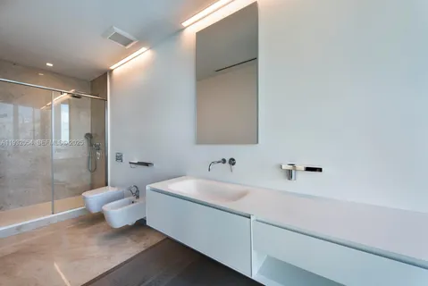 a bathroom with a bathtub and a sink