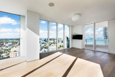 a view of a living room and a large window