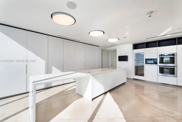 a living room with furniture and white walls
