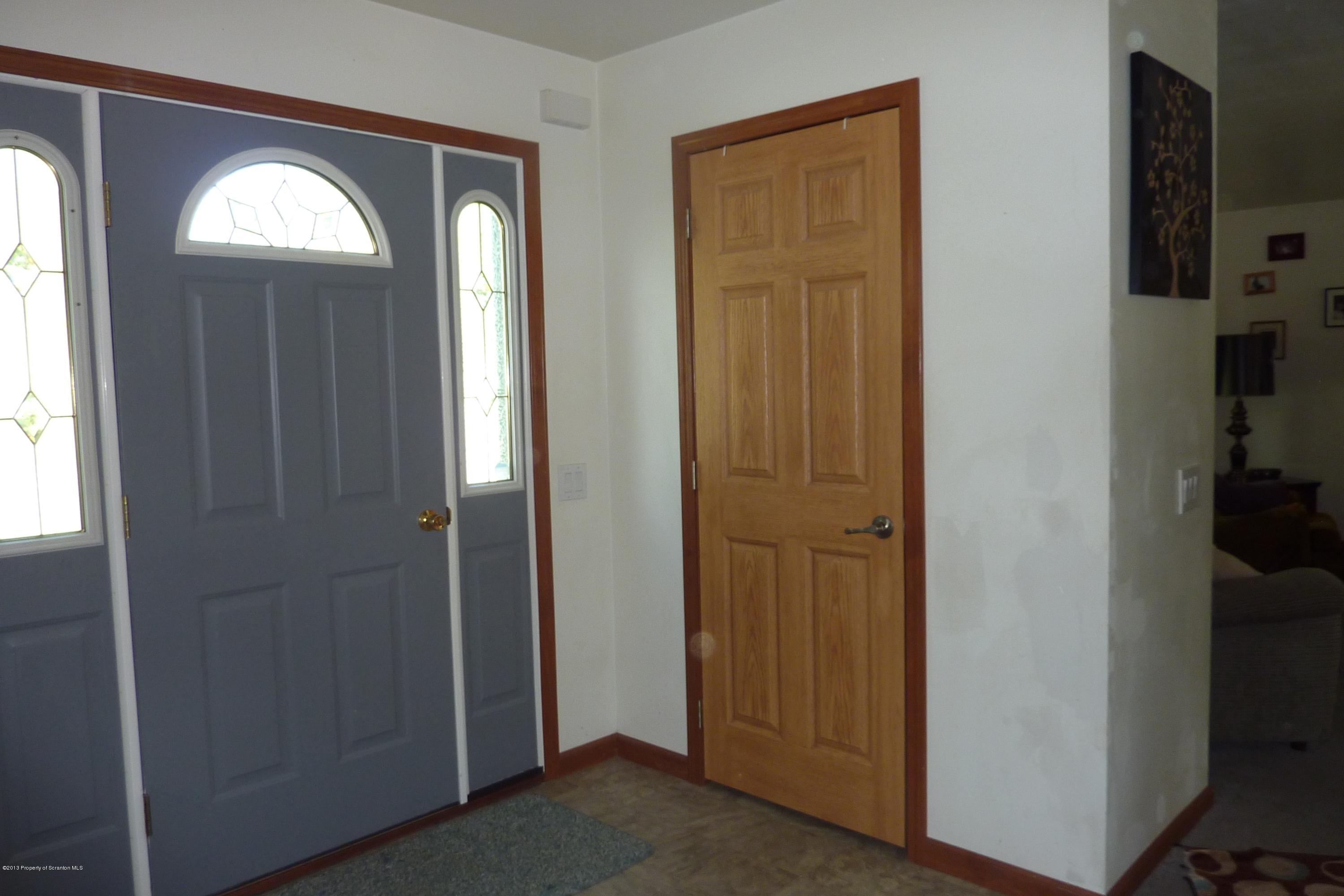 4110 Bear Brook Road Moscow, PA 18444 - Photo 3 of 31 a view of empty room with windows and closet