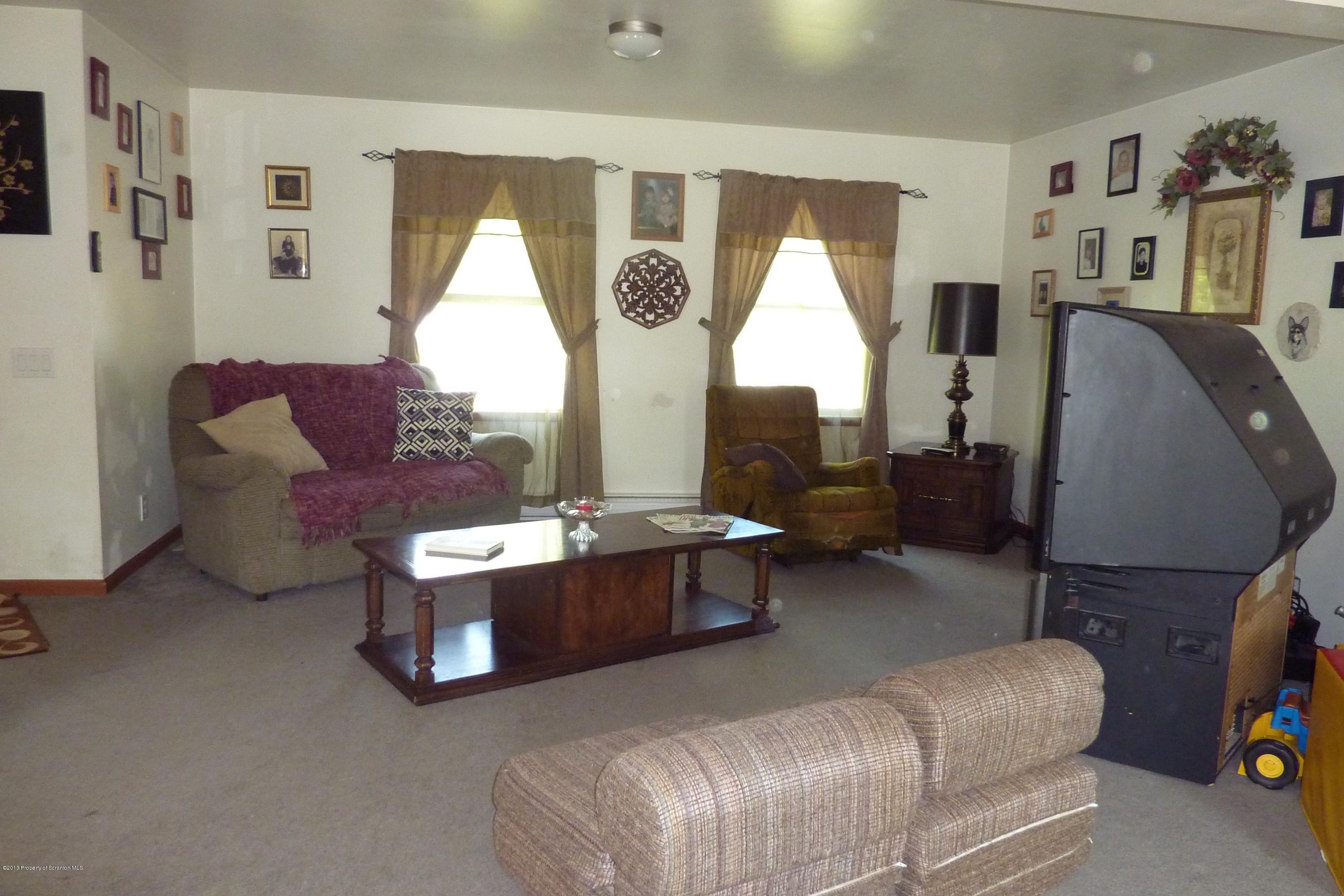 4110 Bear Brook Road Moscow, PA 18444 - Photo 8 of 31 a living room with furniture and a large window