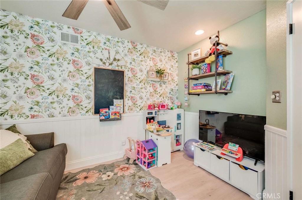 10744 Sundance Drive Rancho Cucamonga, CA 91730 - Photo 12 of 27 a living room with furniture and a flat screen tv