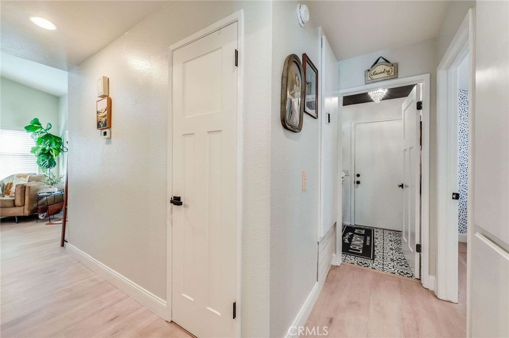 10744 Sundance Drive Rancho Cucamonga, CA 91730 - Photo 13 of 27 a view of a room with a walk in closet and wooden floor