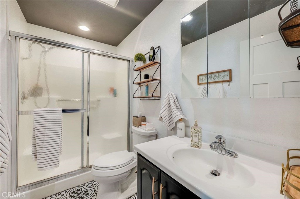 10744 Sundance Drive Rancho Cucamonga, CA 91730 - Photo 20 of 27 a bathroom with a sink toilet and shower