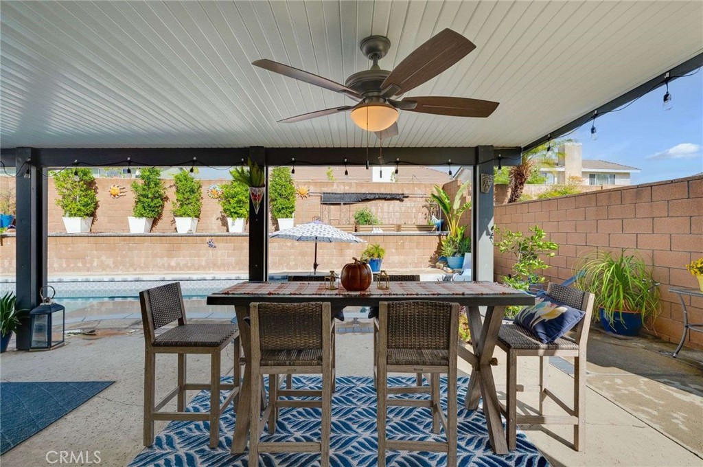 10744 Sundance Drive Rancho Cucamonga, CA 91730 - Photo 22 of 27 a view of a dining room with furniture window and outside view