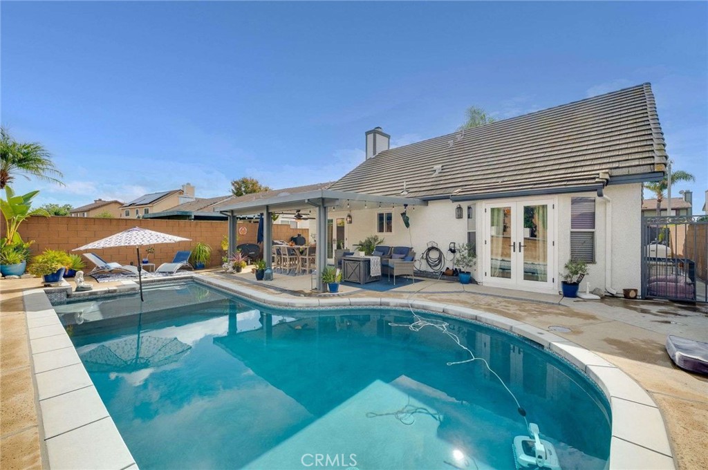 10744 Sundance Drive Rancho Cucamonga, CA 91730 - Photo 26 of 27 a view of a house with pool and chairs