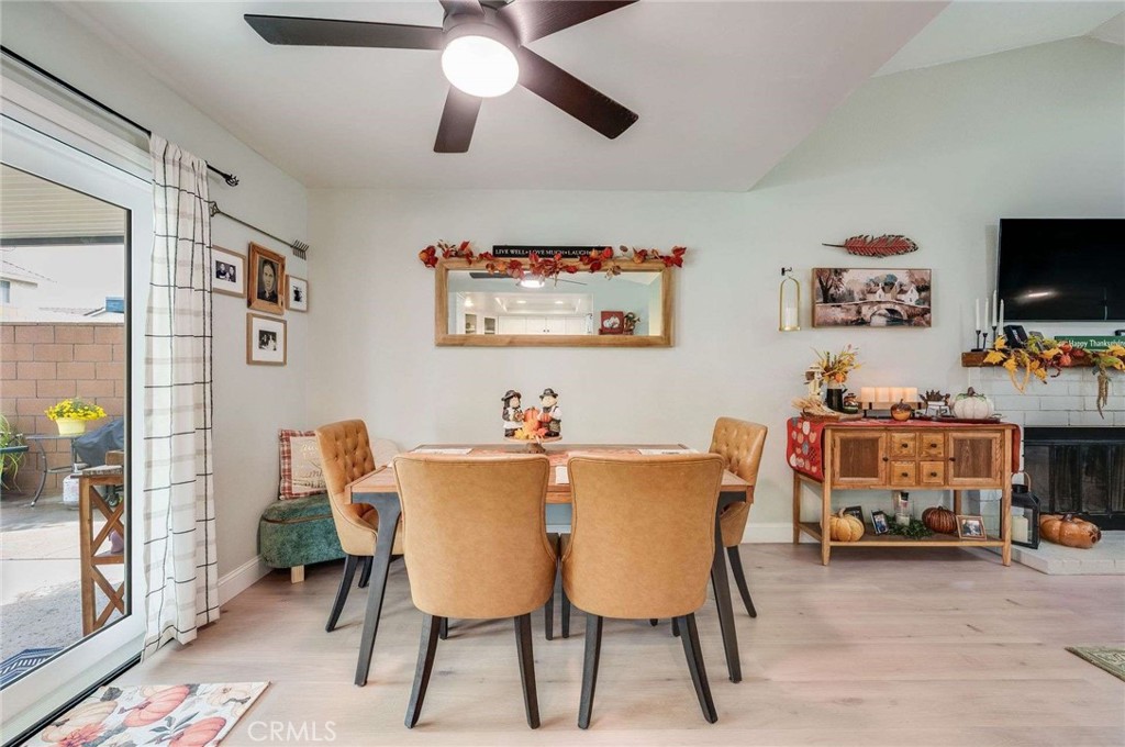 10744 Sundance Drive Rancho Cucamonga, CA 91730 - Photo 7 of 27 a view of a dining room with furniture and a chandelier fan