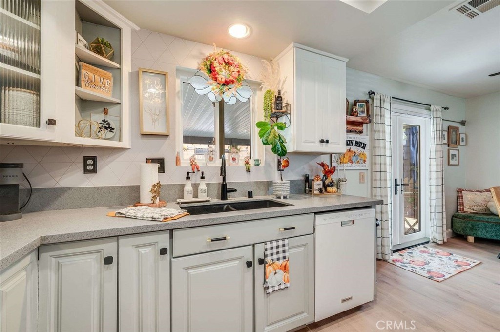 10744 Sundance Drive Rancho Cucamonga, CA 91730 - Photo 9 of 27 a kitchen with a sink stove and cabinets