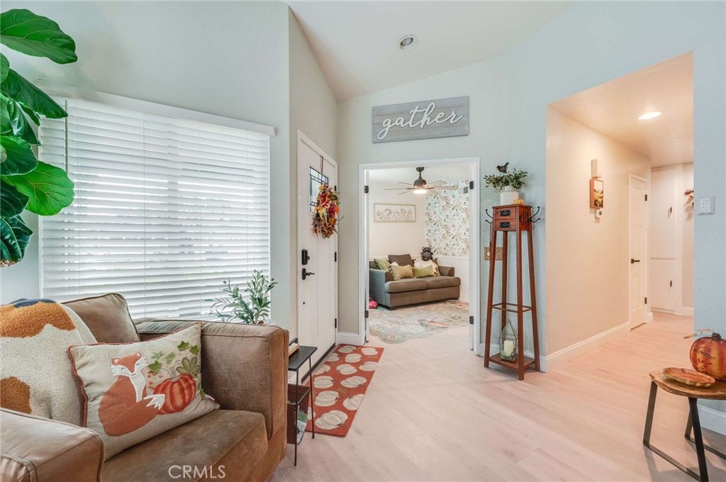 10744 Sundance Drive Rancho Cucamonga, CA 91730 - Photo 10 of 27 a living room with furniture and a large window