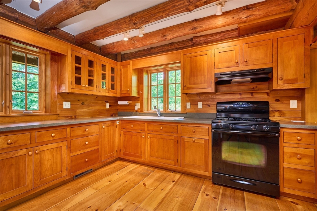 63 Montague Road Leverett, MA 01054 - Photo 13 of 42 a kitchen with stainless steel appliances granite countertop a stove and a sink