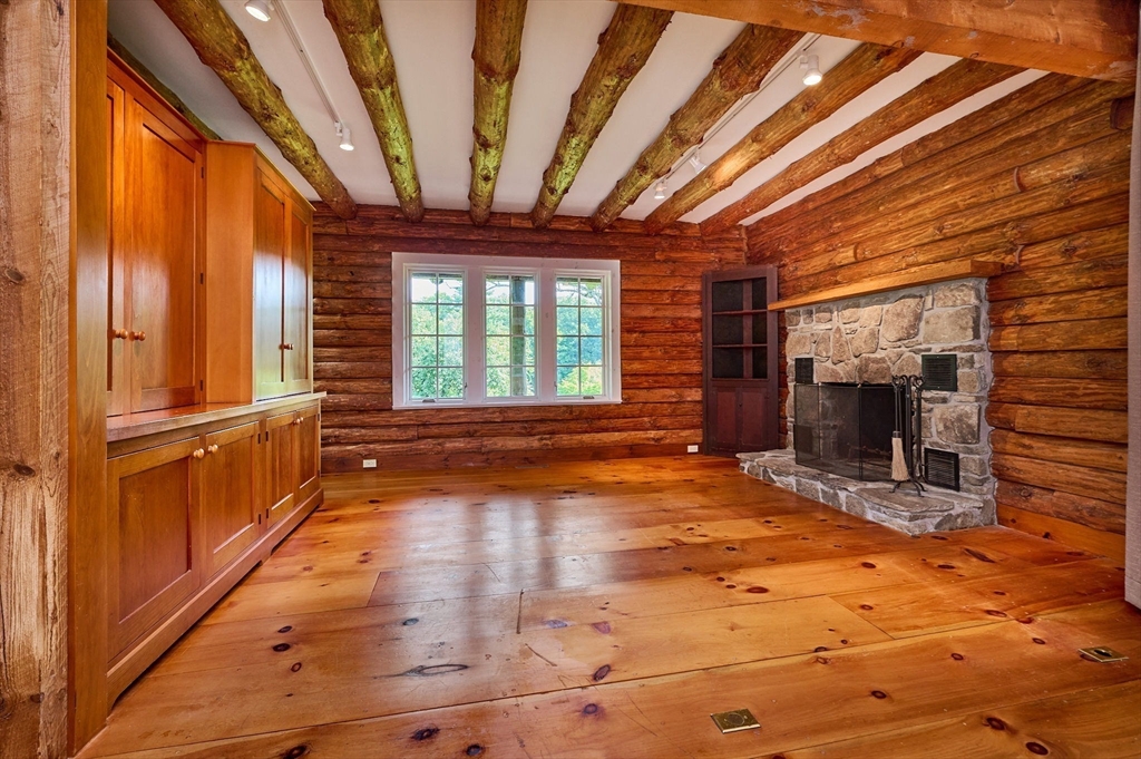 63 Montague Road Leverett, MA 01054 - Photo 14 of 42 a view of a room with wooden floor and furniture