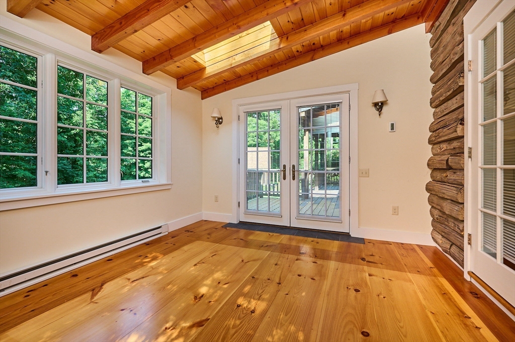 63 Montague Road Leverett, MA 01054 - Photo 19 of 42 a view of an empty room with a window and outer view