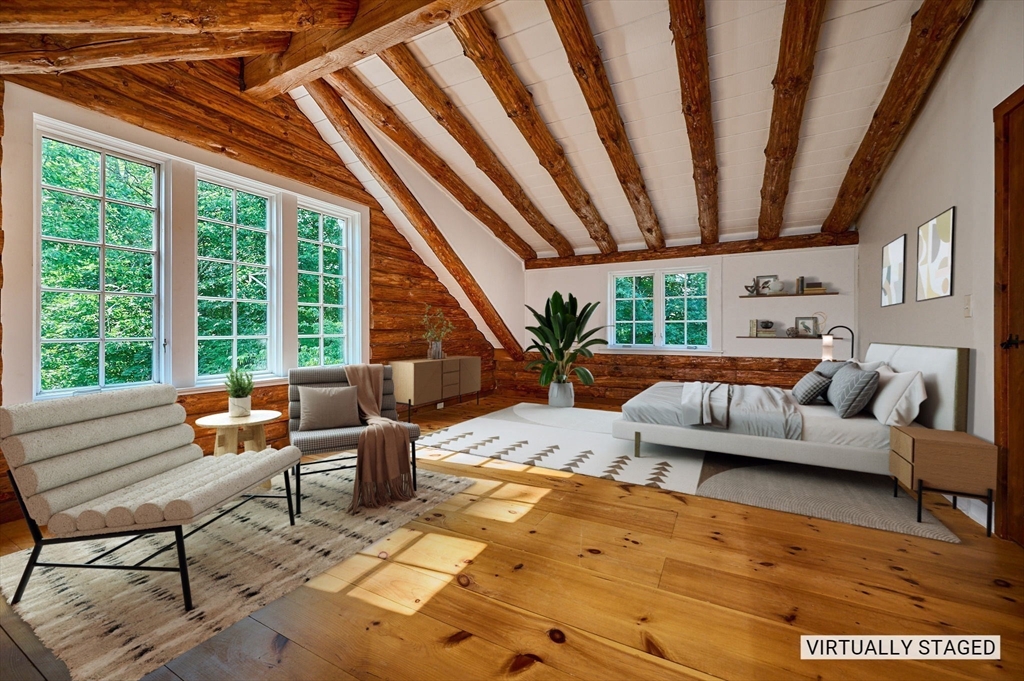 63 Montague Road Leverett, MA 01054 - Photo 23 of 42 a living room with furniture and a large window