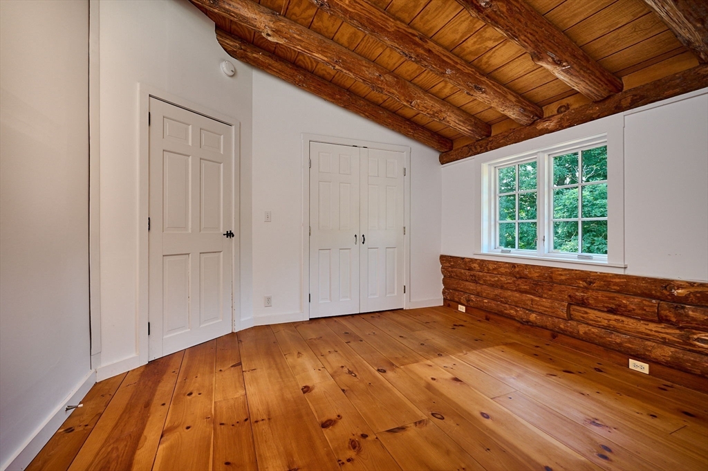 63 Montague Road Leverett, MA 01054 - Photo 24 of 42 a view of room with window and wooden floor