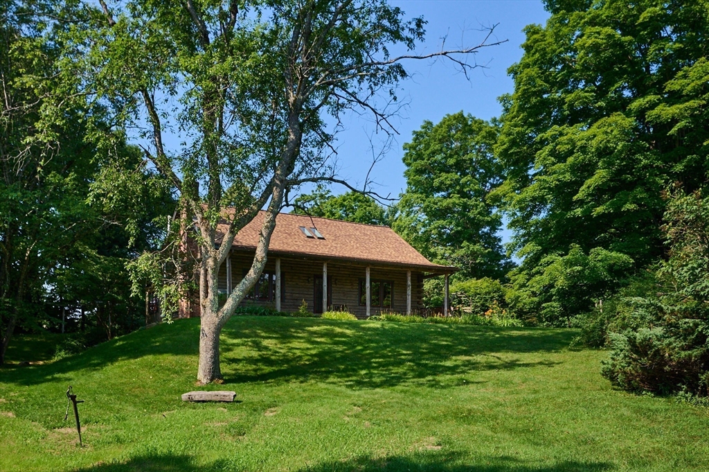 63 Montague Road Leverett, MA 01054 - Photo 32 of 42 a front view of a house with a yard