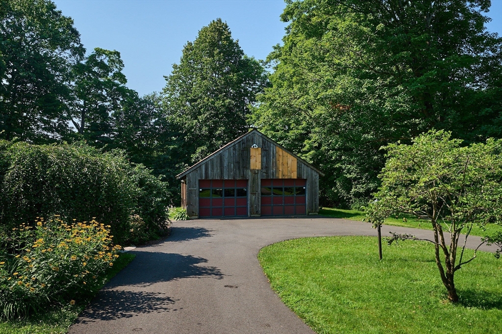 63 Montague Road Leverett, MA 01054 - Photo 36 of 42 a house with trees in the background