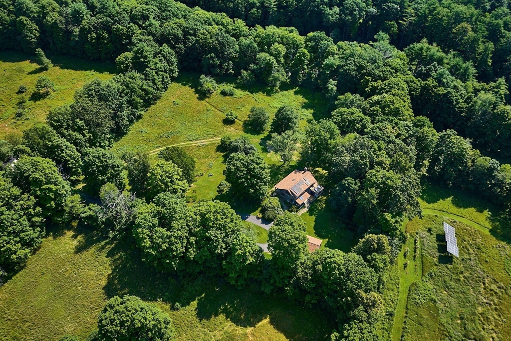 63 Montague Road Leverett, MA 01054 - Photo 42 of 42 an aerial view of residential house with swimming pool and outdoor seating