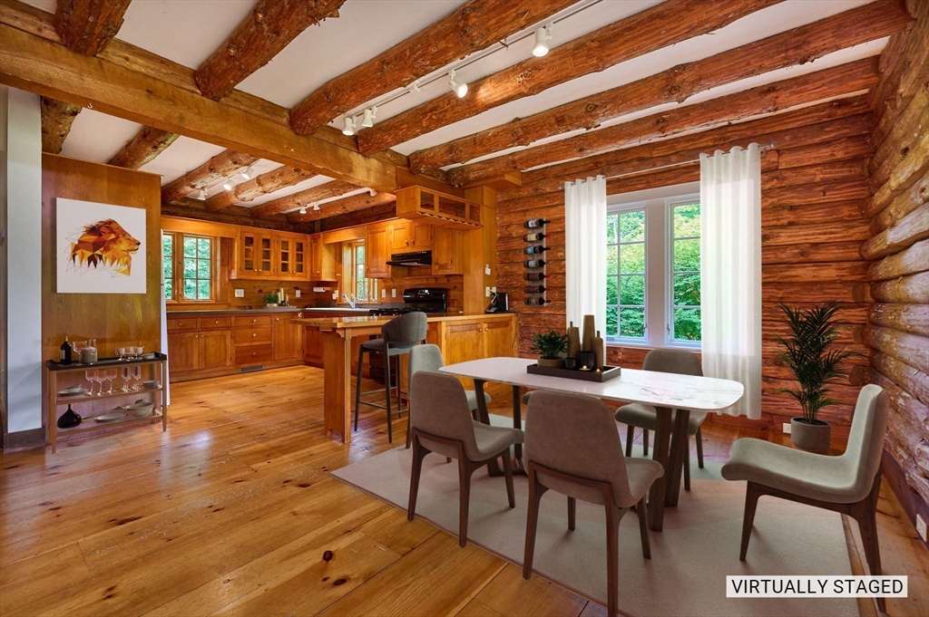 63 Montague Road Leverett, MA 01054 - Photo 10 of 42 a view of a dining room with furniture and wooden floor