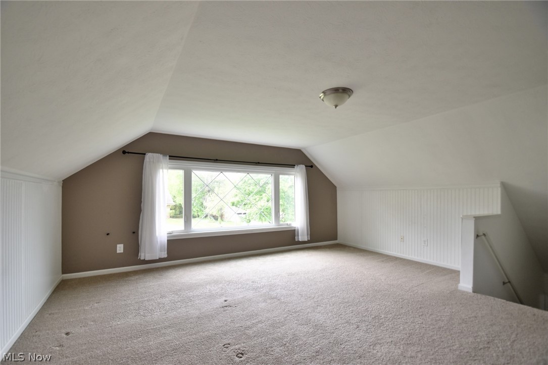 23901 Hazelmere Road Shaker Heights, OH 44122 - Photo 31 of 35 Bonus room featuring carpet floors and vaulted ceiling