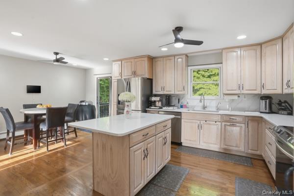 31 Laura Road Monroe, NY 10950 - Photo 11 of 39 a kitchen with kitchen island granite countertop a sink cabinets and window