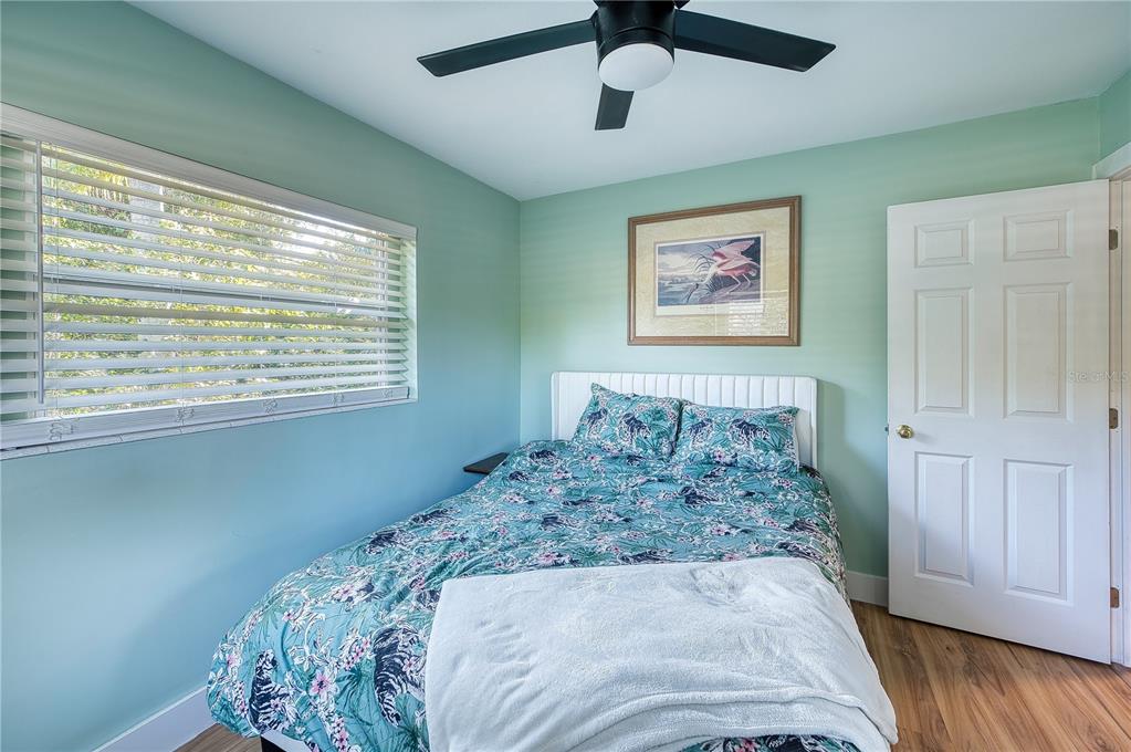 1027 Coral Ridge Drive Punta Gorda, FL 33950 - Photo 16 of 46 a bedroom with bed and a window