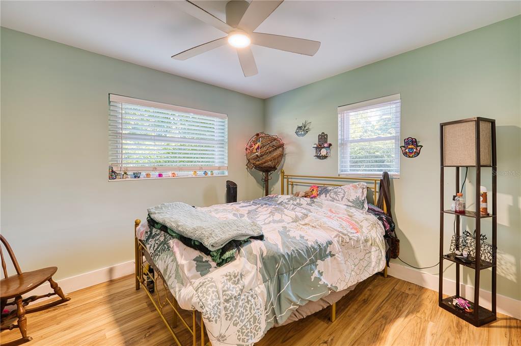 1027 Coral Ridge Drive Punta Gorda, FL 33950 - Photo 18 of 46 a bedroom with a bed and a table in it