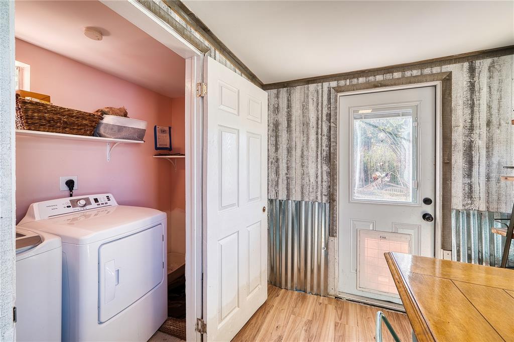 1027 Coral Ridge Drive Punta Gorda, FL 33950 - Photo 22 of 46 a view of a hallway with washer and dryer