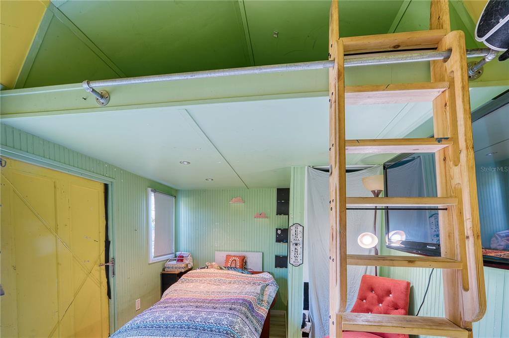 1027 Coral Ridge Drive Punta Gorda, FL 33950 - Photo 24 of 46 a bedroom with a bed and a window