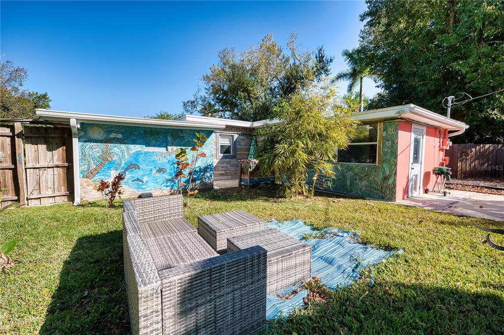 1027 Coral Ridge Drive Punta Gorda, FL 33950 - Photo 29 of 46 a view of a house with backyard and sitting area