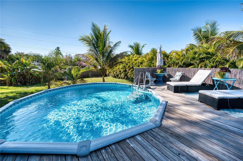 1027 Coral Ridge Drive Punta Gorda, FL 33950 - Photo 32 of 46 a view of a swimming pool with a patio