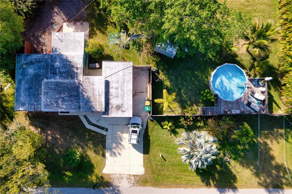 1027 Coral Ridge Drive Punta Gorda, FL 33950 - Photo 39 of 46 an aerial view of a house with a yard basket ball court and outdoor seating