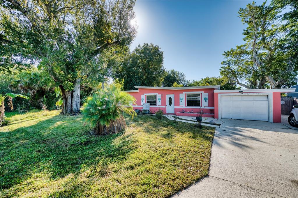 1027 Coral Ridge Drive Punta Gorda, FL 33950 - Photo 4 of 46 a view of a house with a yard
