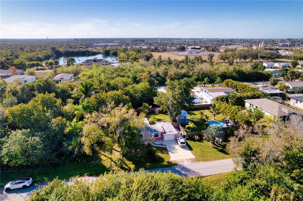 1027 Coral Ridge Drive Punta Gorda, FL 33950 - Photo 41 of 46 an aerial view of residential houses with outdoor space and trees
