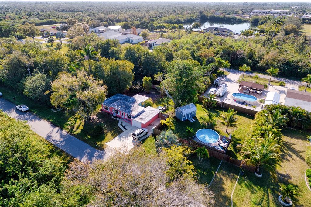 1027 Coral Ridge Drive Punta Gorda, FL 33950 - Photo 46 of 46 an aerial view of residential houses with outdoor space and trees