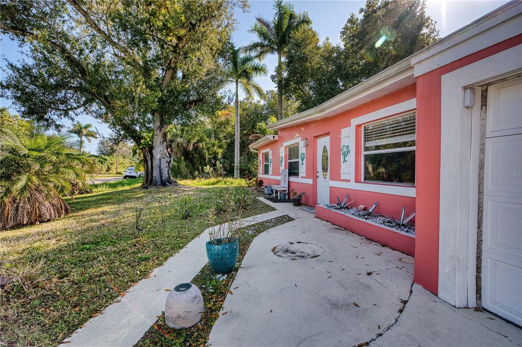 1027 Coral Ridge Drive Punta Gorda, FL 33950 - Photo 5 of 46 a front view of a house with a yard