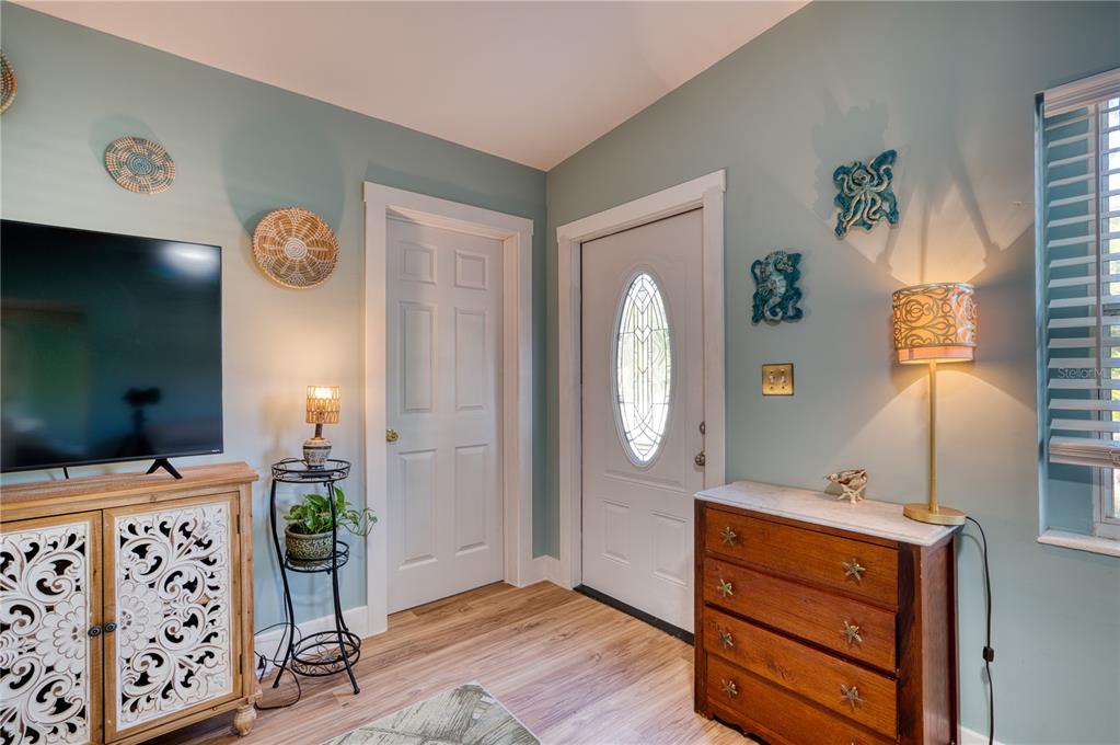 1027 Coral Ridge Drive Punta Gorda, FL 33950 - Photo 6 of 46 a view of a livingroom with furniture and wooden floor