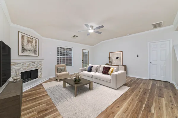 a living room with furniture and a fireplace